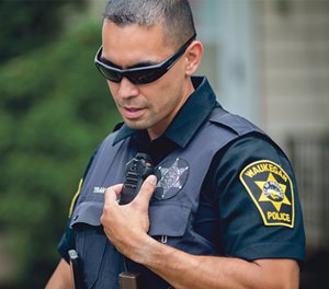 Officer talking into handheld